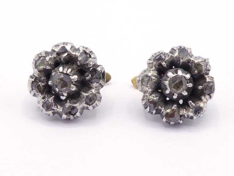 A pair of Georgian diamond earrings, each cluster set with nine rose cut stones, mounted in gold