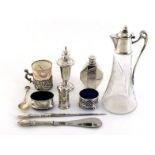 A plain oval silver salt on fluted bracket feet, blue glass liner and a matching cylindrical pepper,