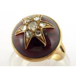 A Victorian garnet and diamond ring, circa 1860, the circular garnet cabochon 14.6mm, mounted with a