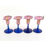 A set of four delicate glass posy holders, each formed as a lily in mauve, yellow and white streaked