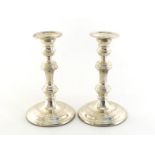 A pair of silver candlesticks by Asprey & Co. Ltd., London, 2003, of George II style, knopped