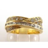 A diamond band ring, the three strand cross over bezel set with two bands of pave set brilliants,