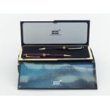 MONTBLANC, a black resin ballpoint pen and burgundy resin pencil, in box CONDITION: the latter