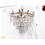 A Crystal glass cascade chandelier, possibly Swarovski, composed of four concentric rings of