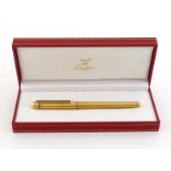 CARTIER, Must de Cartier, a gold plated fountain pen, with fine nib and cartridge filler, in