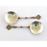 A pair of Edwardian silver fancy serving spoons by William Hutton & Sons Ltd., London, 1903, with