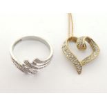 A 9 carat gold and diamond ring, the two strand twist illusion set with small brilliants, the