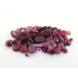 A quantity of loose polished garnets, approx. 21.8 carats, various cuts and sizes. (VAT will be