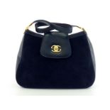 A vintage Gucci navy blue suede and leather handbag with goldtone hardware and double G logo to