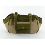 PRADA, a green suede and fabric handbag, with brass fittings and trim, two interior pockets, 19 x
