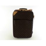 A Louis Vuitton monogrammed 55 Roll-on cabin suitcase, with leather name tag and hand strap, and