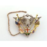 A diamond and enamel brooch/pendant, the Arms of London surmounted by an eagle pave set overall with