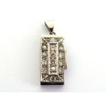 A platinum and diamond clasp, adapted as a pendant, the rectangular clasp pave set overall with