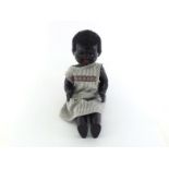 A 1950s Pedigree black doll with "mama" call, not working, and walking and sitting action legs and