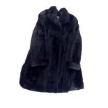 A black ranched mink fur coat by Milady of Paris, size medium.