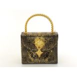 A Gianfranco Ferre handbag with goldtone handle and lions head motif. Classic 1990's styling with