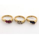 A set of three gem-set stacking rings, each set with three central marquise cut stones (diamond,