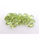 A quantity of loose polished peridots, approx. 4.67 carats, various cuts and sizes. (VAT will be