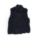 A black rabbit fur gilet. Size medium.