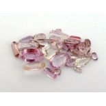 A mixed lot of loose cut rose quartz, the largest a 12 x 8mm pear cut, totalling approx. 29.5 carats