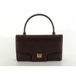 GUCCI, a 1970s brown leather handbag, with rose gilt fittings, stitched seams, and tan leather