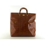 A Gianfranco Ferre embossed leather handbag. Labelled inside "Gianfranco Ferre Made in Italy". Comes