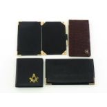 A leather folding wallet card case bearing the Masonic Square and Compasses emblem, another black