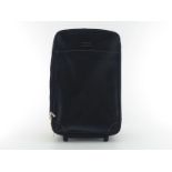 A Hartmann black leather cabin roll-on. Length 56cm Width 36cm. CONDITION: Very good, minimal