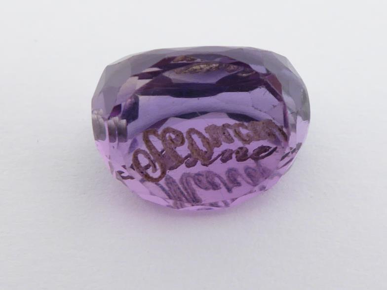 Three loose carved amethysts, including a swivel fob, a intaglio cut seal, and a foliate carved - Image 4 of 4