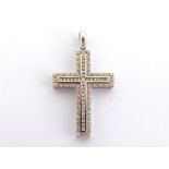 A diamond cross pendant, pave set overall with small brilliants, the white mount stamped '750', 3.