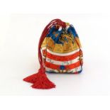 A Gianfranco Ferre 1990's pouch style bag with nautical print nylon body and red tasselled straps,