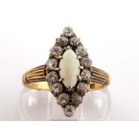 An opal and diamond cluster ring, the marquise bezel with central opal cabochon 8 x 4mm, in a