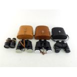 Four pairs of binoculars, comprising a WWI pair of French manufacture for the British army with