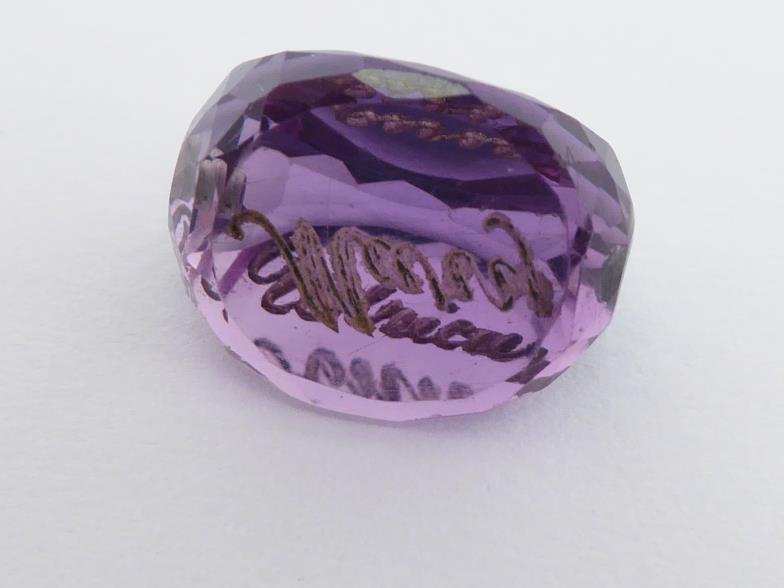 Three loose carved amethysts, including a swivel fob, a intaglio cut seal, and a foliate carved - Image 3 of 4
