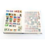 A stock album with a large well sorted collection of postage stamps, particularly Turkish, Greek,