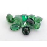 A mixed lot of untested green stones, approx. 5.82 carats. (VAT will be added to the hammer on