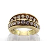 A mid 20th century diamond ring, composed of bifurcated bands, each pave set with a line of