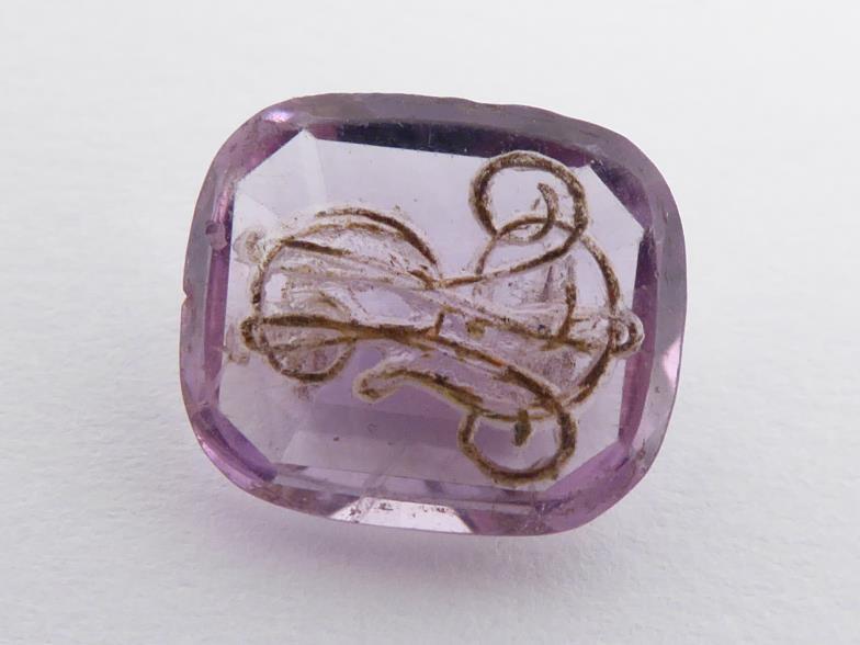 Three loose carved amethysts, including a swivel fob, a intaglio cut seal, and a foliate carved - Image 2 of 4