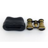A pair of opera glasses in brass with black enamel finish. Both barrels are well engraved with