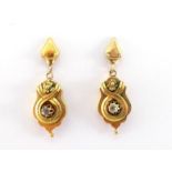 A pair of Victorian gold (tests 15 carat) and diamond earrings, the small cartouche drops each set