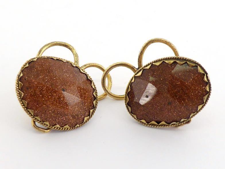 A pair of 18th century goldstone earrings, each faceted oval stone 19mm long, collet set in a yellow