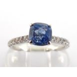 WITHDRAWN A sapphire and diamond ring, the cushion cut stone 1.38 carats, to brilliant set