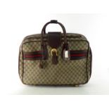 A vintage Gucci monogrammed weekend travel bag, circa 1970's. Labelled inside Made in Italy by