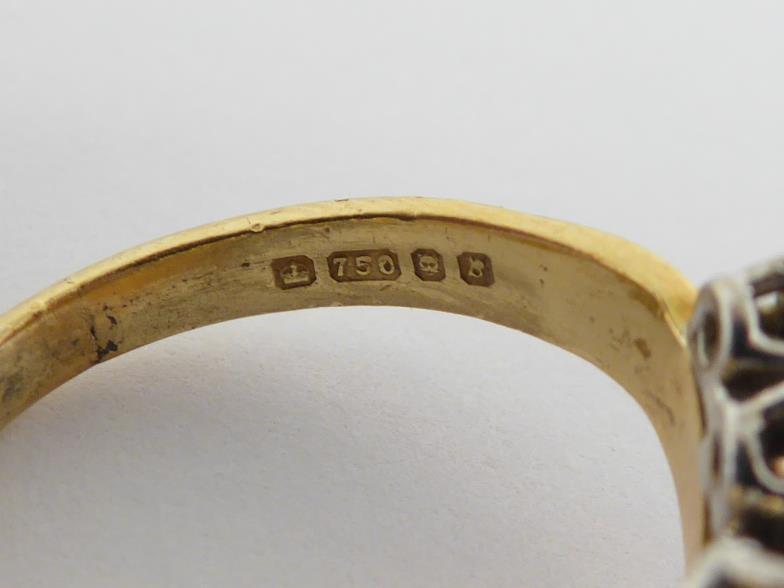 An 18 carat gold and diamond dress ring, the undulating bezel set either side with graduated - Image 5 of 6