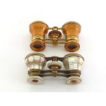 A pair of brass and terracotta guilloche enamel opera glasses by Asprey, London (one lens loose);