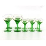 WITHDRAWN A set of six tall ribbed green stemmed wide bowl liqueur glasses and four larger