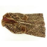 A leopard print Rabbit fur coat, size medium.