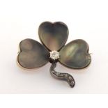 A 19th century diamond and abalone clover brooch, the central brilliant approx. 0.10 carat,