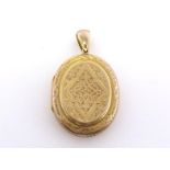 A Victorian yellow metal (tests 9 carat gold) locket, of oval design, chased overall, 4cm long, 12.