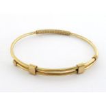 WITHDRAWN GUCCI, a gold bangle, 6.7cm inner diameter, 18gms